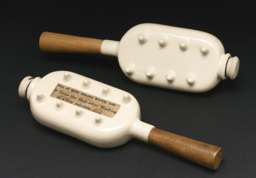 Two late 19th century ‘Thermicon’ glazed stoneware hairdryers with wooden handles. Like a hot water 