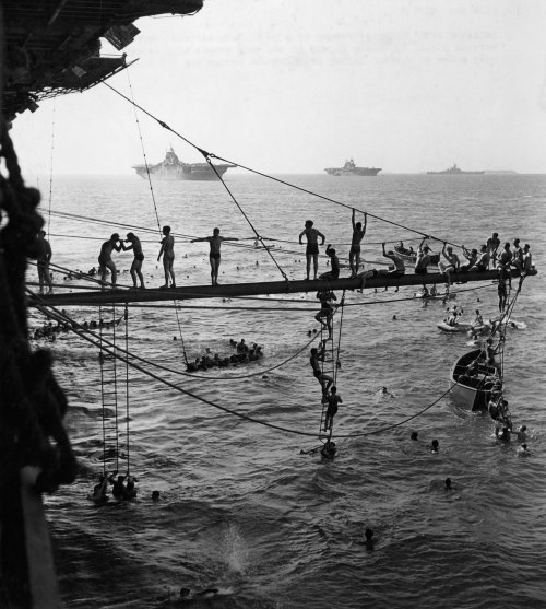 historicaltimes:  Crewmen of a U.S. Navy aircraft carrier in the Marshalls after laying siege to and