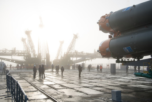 Space Station Bound! : Workers are seen on the launch pad as the Soyuz rocket arrives after being ro