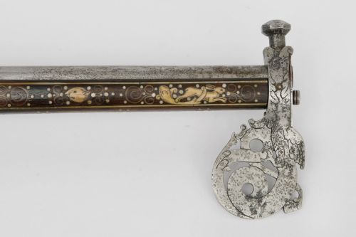 A rare bone and pearl decorated flintlock axe pistol originating from Silesia, circa 1670.