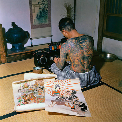 s-h-o-w-a: Japanese tattoo artist, Tokumitsu Uchida proudly displaying tattoo markings made by his father, Goro Uchida, Japan, 1955