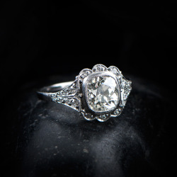 estatediamondjewelry:  A stunning Old Mine Antique Cushion Cut Diamond Engagement Ring. Old Mine Diamond Circa 1920. Handmade platinum. Stunning openwork filigree and milgrain on the lower gallery.