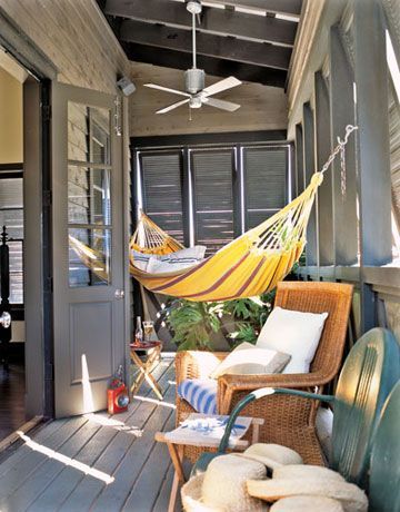 sweetestesthome:
“Hammock This porch was made for relaxation. Louvered shutters keep the midday sun at bay while overhead fans get the air circulating. A wicker chair with plush cushions and a Brazilian hammock provide unbeatable lounge spots. Photo...