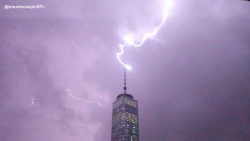 abcnews:  A lightning bolt strikes the top of the Freedom Tower in New York City on Thursday - ABC News Weather - [PHOTO: @maximusupinNYc]