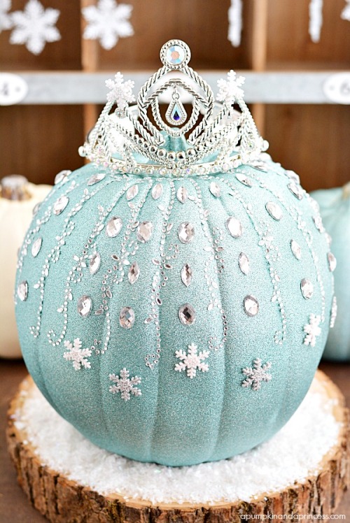 DIY Frozen Elsa Pumpkin Tutorial from A Pumpkin & a Princess. A fake white pumpkin is covered in
