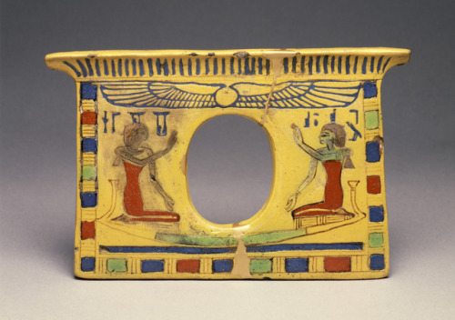 Ancient Egyptian pectoral (faience with yellow glaze) in the shape of a shrine, depicting the goddes