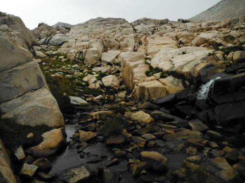 It starting rain, so I’m following this creek to the upper lakes where I’ll find a place to Camp. Ea