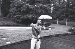 adoringtupac:  Tupac hanging out by his pool Atlanta, GA 1994 photographed by Chi Modu 