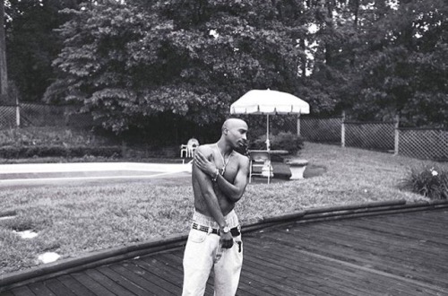 adoringtupac - Tupac hanging out by his pool Atlanta, GA 1994...