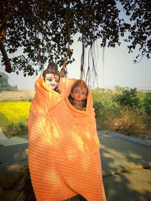 Someone put a blanket over Shiva and Parvati in a village in Bengal, devotion