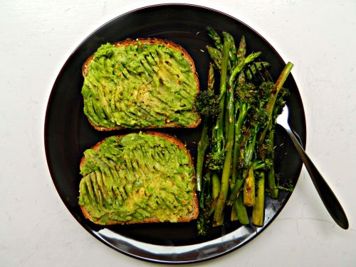 Brunch today - two slices of multigrain seeded toast with smashed avocado, lemon juice, black pepper