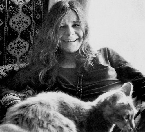 Janis with her doggy and kitty in their San Francisco apartment, photos by Baron Wolman.