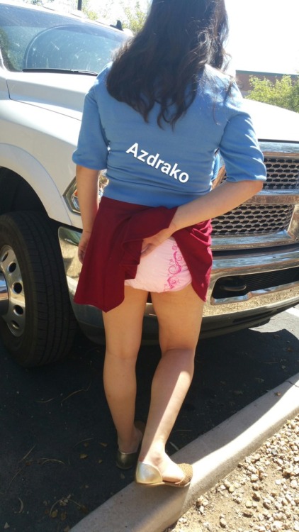 azdrako:Today baby cat went out in her short flimsy skirt and just loves her pink dc diapers barely being covered by her skirt. I opened the door and snapped a couple of pictures of her getting out of the truck and told her to go to the front of the truck