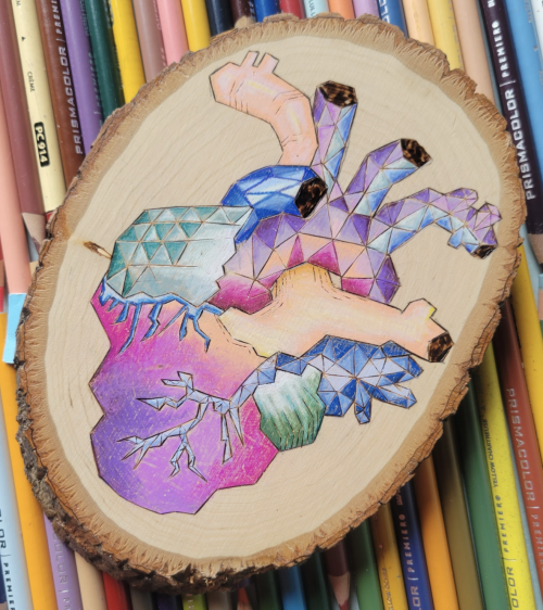 Color Me With LifeGeometric heart, woodburning with vibrant colors. By Megan (unstrungstudios). Foll