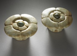 ancientart:  Earflares from ancient Maya. Earflares were used in ancient Maya to stretch and be worn in the ear of the user. Some of their designs are similar to today’s ear plugs or tunnels. Worn by the elite, jade earflares were a mark of power and