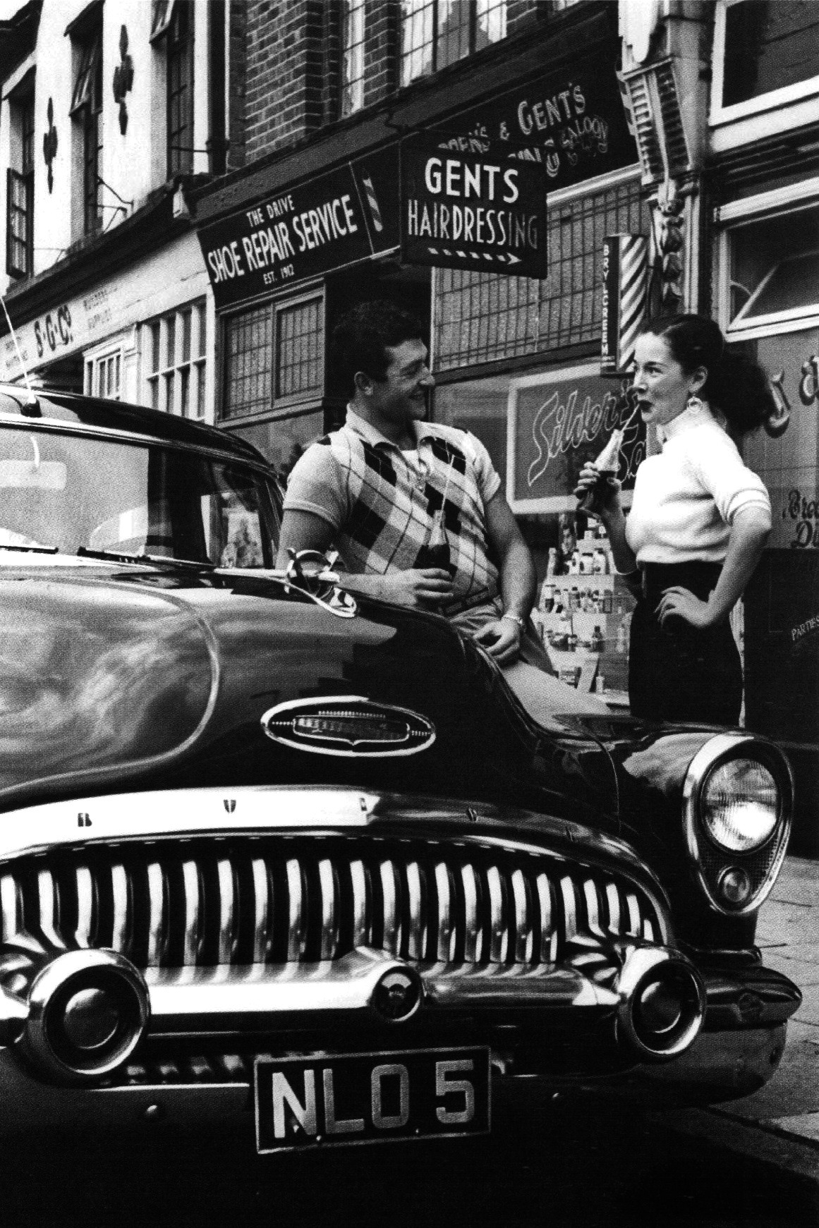 updownsmilefrown:  Owner of a Buick impressing a young woman, October 1954 