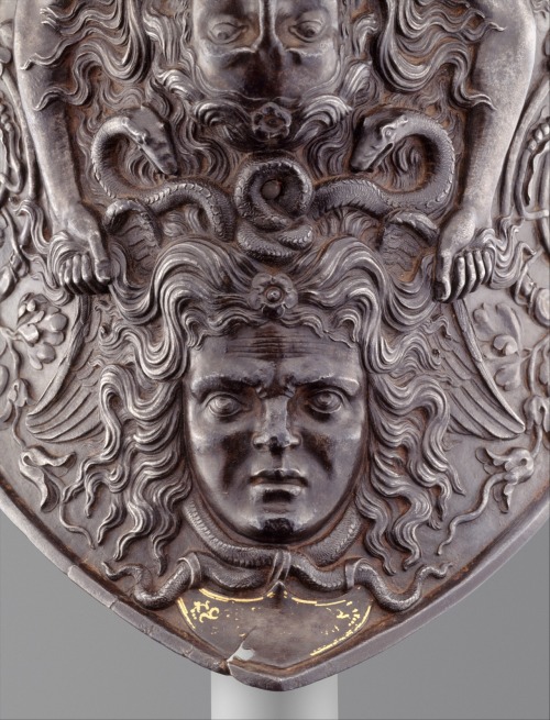 Burgonet: A mermaidlike siren forming the helmet’s comb holds a grimacing head of Medusa by th