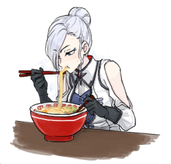 A beautiful woman is eating noodles.