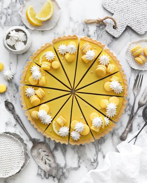 A delicious-looking lemon pie with meringue cookies and macarons. Made with by @nm_meiyee (recipe).R