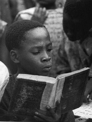 nigerianostalgia:  A boy reading the Quran at a school in Lagos. 1960sVintage Nigeria