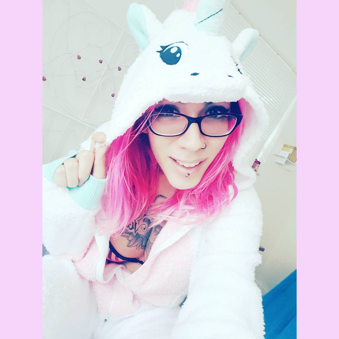 I&rsquo;m a unicorn! #onesie #cute #girls #pinkhair #girlswithtattoos #glasses