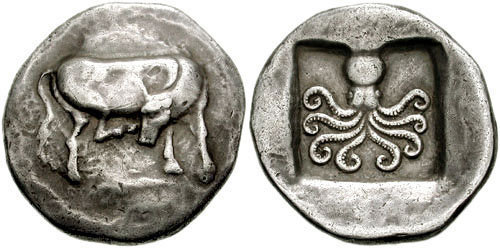 Silver didrachm of the Euboean polis of Eretria.  On the obverse, a cow scratching its head with its