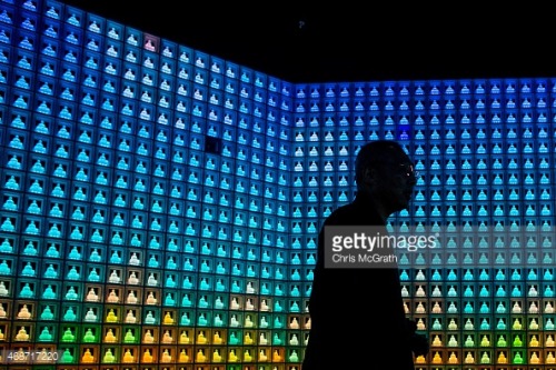 Koukokuji temple head priest Yajima Taijun walks through the Ruriden columbarium as glass Buddha alt