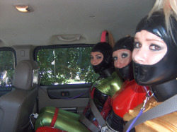 sir-gray66:  These 3 in the back seat thought it was fun to do a fetish photo shoot .the photograph a woman talked them into the bondage when the had the suits on then the hoods with built in gags after the ankle cuffs and collars the 3 was led down the