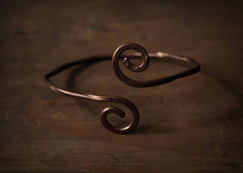 One-of-a-kind handmade copper bracelet. The bracelet is handcrafted from pure copper wire and artifi