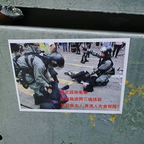 Someone was quick to print this sticker of the two unarmed protestors shot by a traffic cop &amp