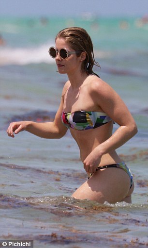 Emily Bett Rickards in bikini at beach in Miami