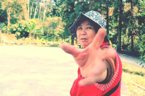 Snapshot of my grandma; I wasn’t sure if she was trying to grab my lens or simply waving to me