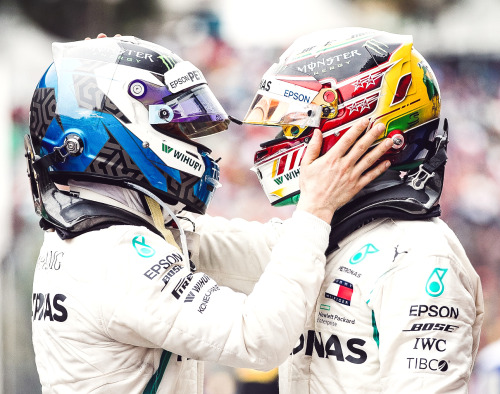 electric-arc:Lewis Hamilton celebrates with his team mate Valtteri Bottas after winning the F1 Brazi