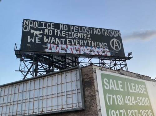 “No Police, No Pelosi, No Prisons, No Presidents!! We Want Everything”Billboard graffiti