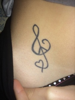 milsotherapy:  stormymelodies:  Milsotherapys tattoo discussion! This means peace love and music. Peace because i am known to be the peace maker. Love because Amanda means loveable and music because music is my life without being able to listen or play