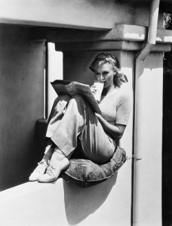 dwellsinparadise:Ginger Rogers reading about Nijinsky https://painted-face.com/