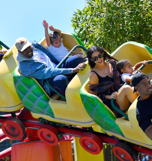 celebsofcolor: Kanye West, Kim Kardashian and North West in Disneyland