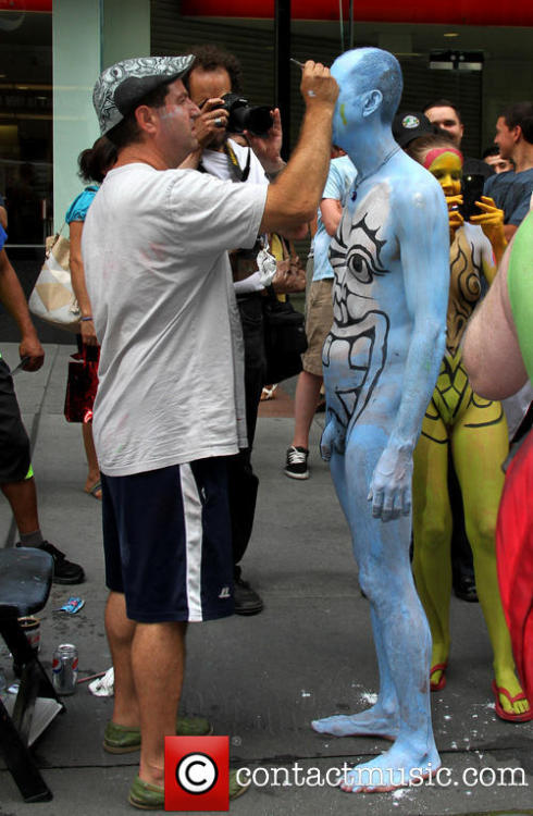 maleinstructor:  Bodypainting artist Andy Golub paints the naked bodies of men and women on Broadway, New York City. 