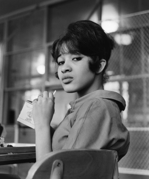 swoonatra:Ronnie Spector photographed in the cafeteria of George Washington High School in New York City during her senior year before The Ronettes became famous, 1961