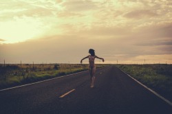 jordanlehn:  in between a storm, on the road in the middle of New Mexico last summer. i love the feeling of freedom the open road gives. I can’t wait to have a car again and see where it takes me. 