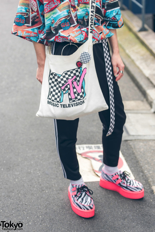 tokyo-fashion:19-year-old Taishin on the street in Harajuku wearing a print shirt with checkerboard belt, skinny pants, neon zebra creepers, and MTV tote bag. Full Look