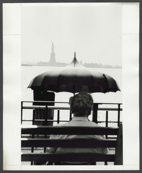 Man looking towards the Statue of Liberty, 1954