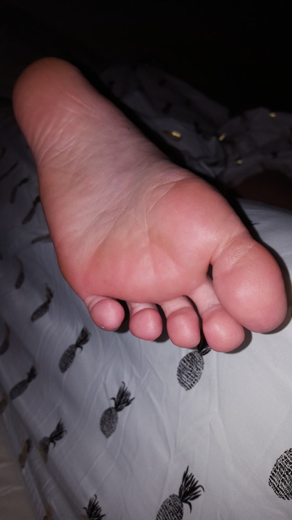 myprettywifesfeet:My pretty wifes sleepy candid foot hanging off the side of the bed.please comment