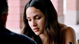 His Words Bring A Smile To Her Lips , Eyes Cast Down At Her Hands So She Doesn't Look At Him . The Warmth