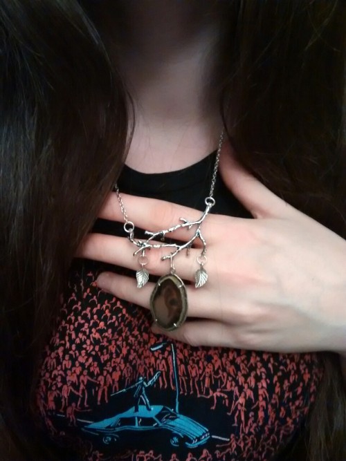 this one of a kind necklace is made of silver twigs, leaves and a thrifted gemstone, it may be agate