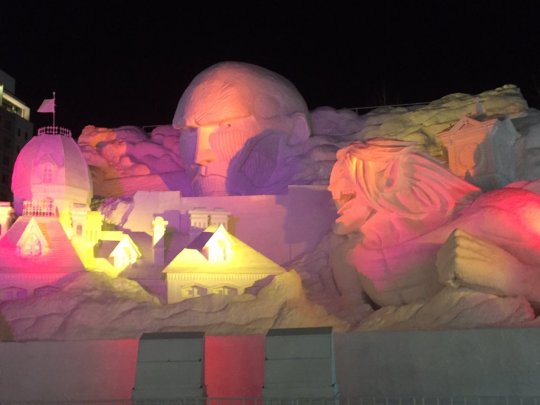 Even more looks at the Colossal Titan model and actual snow sculpture, now opened to the public at the Sapporo Snow Festival! The sculpture turns into a light show at night!The construction of the sculpture can be seen here.The WALL SAPPORO leg of the