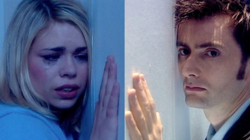 A still from the Doctor Who episode "Doomsday" showing Rose and the Doctor on leading their faces on opposite sides of a wall, Rose crying with her makeup running down her face and the Doctor with a steely expression.