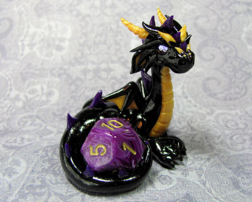 tomarou:  rosesakurax:  thatfilthyanimal:  ensorevolution:  Tiny Dragons That Take Care of Your Gaming Dice http://www.themarysue.com/dice-dragons-becca-golins/#0  [SCREAMS] I WANT THEM  Cuteee  I couldn’t resist reblogging; NO REGRETS 