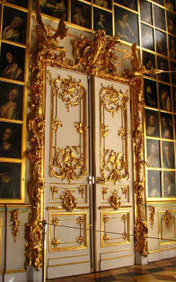 iamveryamused:Interior doors, Peterhof Palace, Saint Petersburg, Russia - just a little dash of something extra! Peterhof is a series of palaces laid out on the order of Peter the Great. It officially opened in 1723, but was added to for decades.