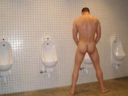 gloryholesandunderstall:  Gloryholes &amp; Understall  Naked at the urinal 